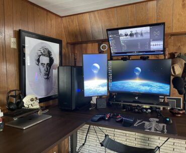 After years of waiting, I've upgraded to a standing corner desk and have created my own corner of solitude. I am pleased.