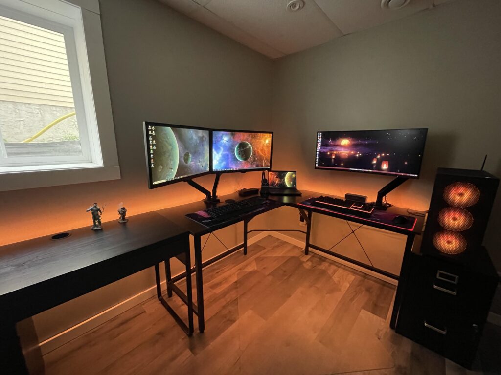 Work setup on the left, gaming on the right. Just needs some personality on the walls now