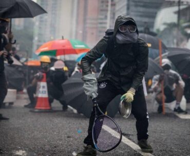 Protesters whip back tear gas with rackets (not mine)