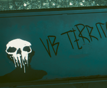 Placide says the Voodoo Boys don't call themselves that, but there is 'VB' graffiti everywhere?