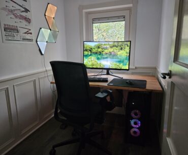 My walk-in battlestation. The desk is as broad as the room!