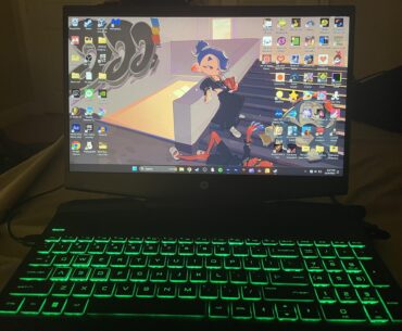 2020 HP Gaming Pavillon with a cheap cooling pad from Amazon on a bed. It ain’t much but it’s honest work