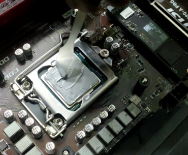 My cousin applying thermal paste to my new CPU