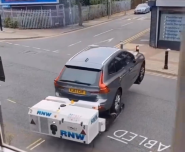 Robot Tow Removes Car From Disabled Parking.