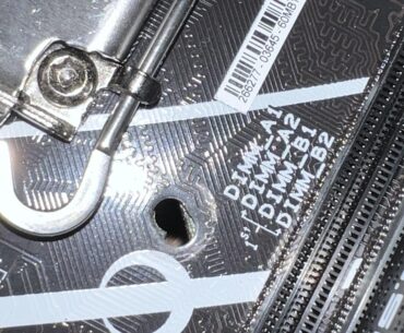 Scratched my motherboard, am I screwed