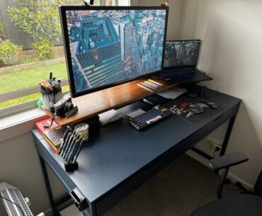 An IKEA Alex desk that finally suits a monitor mount (thanks to a plank of wood and cheap furniture feet)