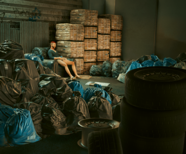 Found the happiest NPC just enjoying his drink in his garbage house.