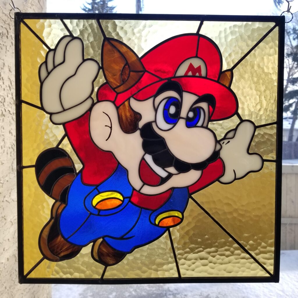 Made a stained glass Raccoon Mario from the SMB3 box art!