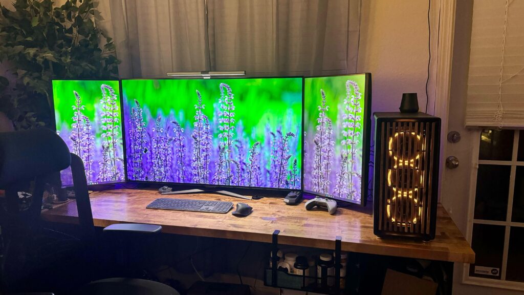 Updated 3 monitor setup. 48" OLED middle with 2 27" side panels