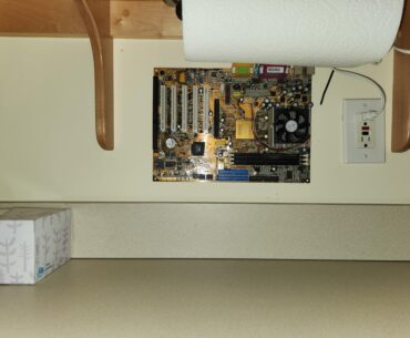 Found this mobo drilled to a wall in an airbnb on the laundry room
