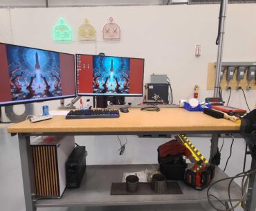 My $3,500,000 setup, $2K for a 7950X3d build in a fractal north case, and $3,498,000 for the custom 8-axis metal 3D printer. Yes this is my desk.