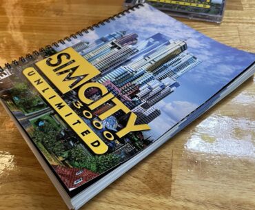 This is the manual that came with SimCity 3000. It's printed on a 224-page spiral notebook.