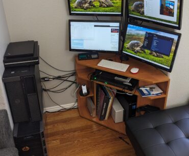 We crammed our home lab, gaming rig, and work laptop dock into an old TV alcove. It's cozy?