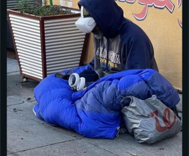 A homeless man using vr
