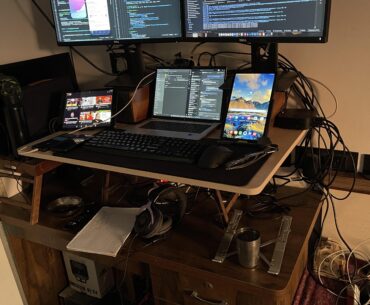 My Jerry rigged cluttered standing workstation. I’m a mobile engineer.