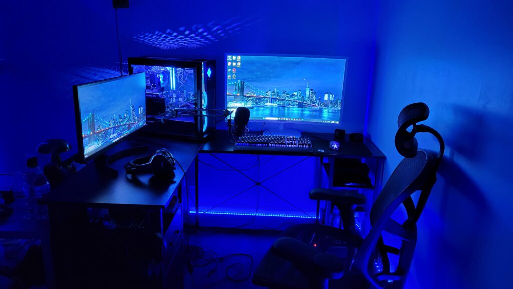 My first serious setup, I'm still working on it, probably going to add another desk behind the big monitor on the right for more desk space, but let me know what you think!