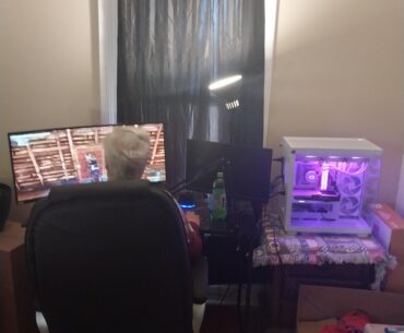 My grandma playing her new pc with her full setup