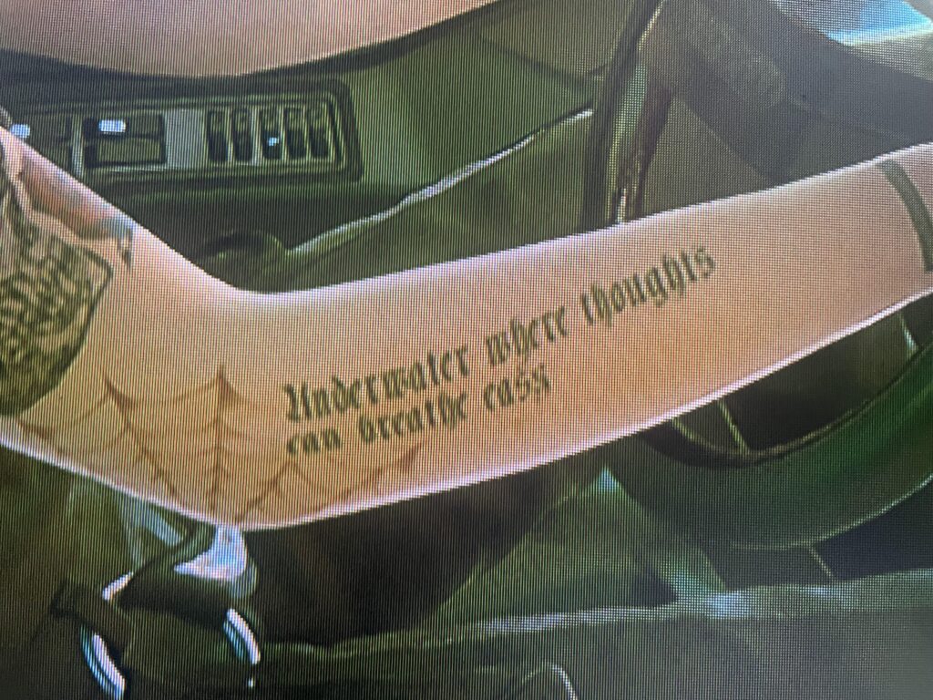 Red Hot Chili Pepper lyrics tatted on Judy’s arm. From the song parallel universe. Thought it was a cool reference.