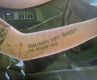 Red Hot Chili Pepper lyrics tatted on Judy’s arm. From the song parallel universe. Thought it was a cool reference.