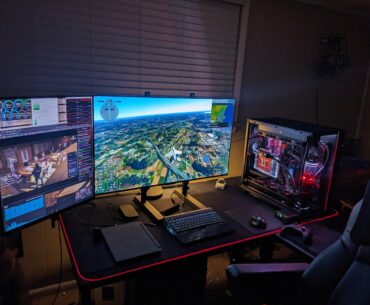 My dream setup. Big ass screens, big height adjustable desk, and an overkill triple rad custom loop