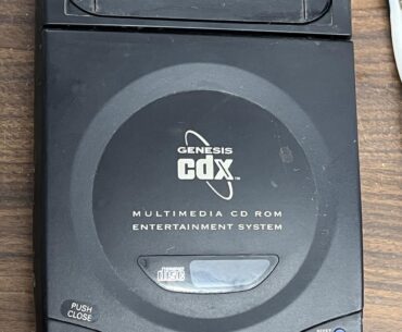The Sega CD X, plays both CD's and Sega games. Only a few thousand was made.