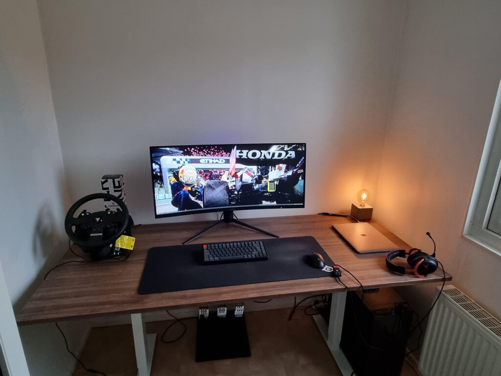 I'm struggling to make this room clean but yet cozy. It's my home office and gaming room. Any advice?