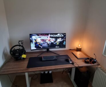 I'm struggling to make this room clean but yet cozy. It's my home office and gaming room. Any advice?