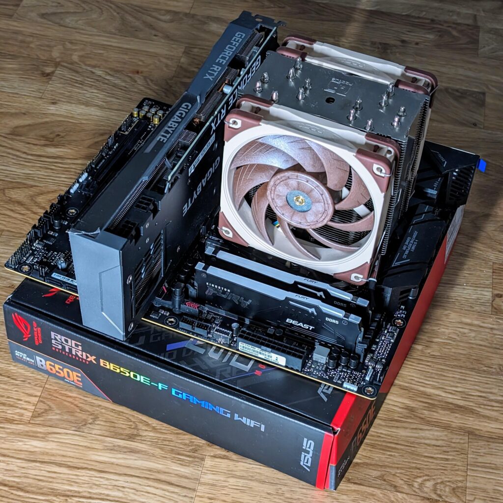 Treating myself by transitioning to AM5 after I've been sober and clean for 2 years today. (7800X3D, Asus Strix B650E-F, 32 Gb Kingston Fury)