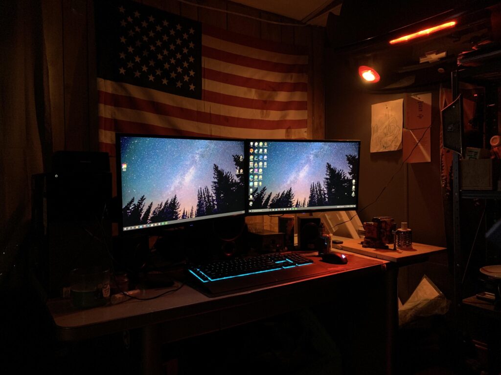 My Junkyard Battlestation. Desk, monitor mounts came from junkyard, trunk off a car I totaled.
