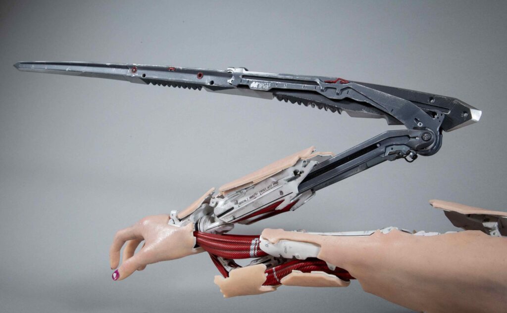 Is the reason we can't wear long sleeves or gloves because the cyberware like mantis blades would clip through it ?