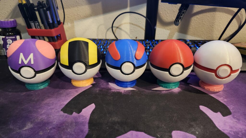 A lot of people liked my 3d printed gameboy color battery cover. So here's some 3D printed pokéballs