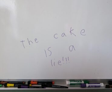 My daughter and I have been playing Portal lately. She wrote this on the wipe off board in my office, I think she likes the game.