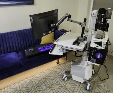 Refitted hospital pc battery cart. Now I stand, lounge on the couch, or put it in a closet out of sight when I have guests over.