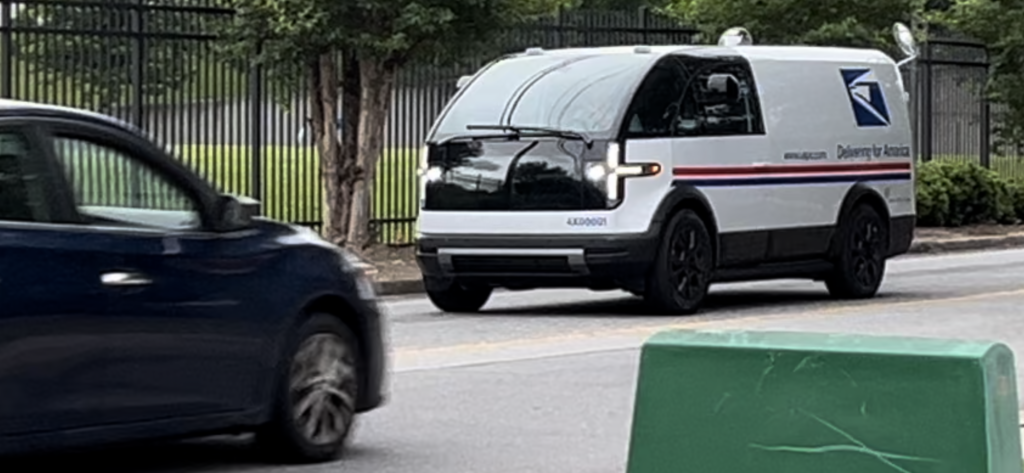 A rare sighting of a super cyberpunk Canoo mail truck, deployed as part of pilot program