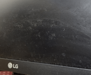 How to clean splotches on monitor? (Tried both water and alcohol on microfiber cloth)
