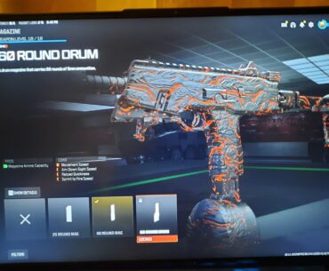 How do I unlock the 60 round mag?