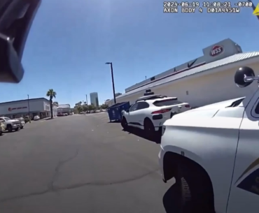 Cop pulling over driverless car.