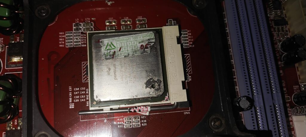 My Cousin's PC from 2003 and he asked me to help fix it. I can see why MB and CPU died.