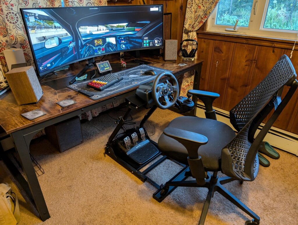 For the 5th time this week, my setup is done. Grabbed a mount for my wheel and pedals, pretty nice improvement over clamping it to the desk.
