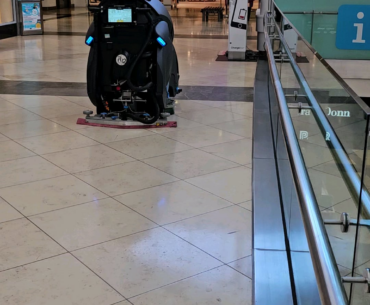 This may have been done before but I've never seen one. Self running robo cleaner in a shopping male that has its map showing its route