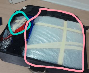 Packing computer in a suitcase for flight.