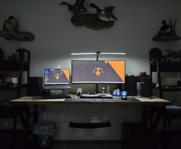 I'm pretty pleased with how my budget multi-use battlestation is coming along. Any suggestions on cable management for cables coming up from the surge protectors?