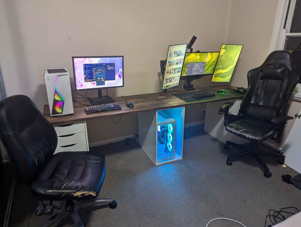 New setup-Had my Gf move in and built a new computer and upgraded my desk gave her my old Computer. The chairs need an upgrade and some leds would not hurt what do you guys think?