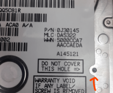 What happens when I cover this hole (red arrow) on hard drive ?