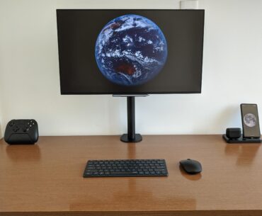 Small table, clean setup. Running on a Surface Pro 9 mounted under the table, witha JBL flip 6 mounted behind the monitor for sound.
