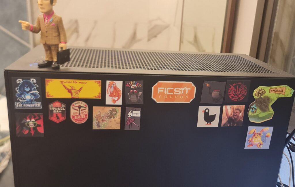 I see your stickers on laptops, I raise you magnets on dekstops.
