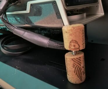 I made a GPU holder with a couple of wine corks and a screw.