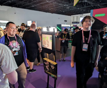 VTuber using a peripheral to explore the Twitchcon exhibition hall and talk to people.