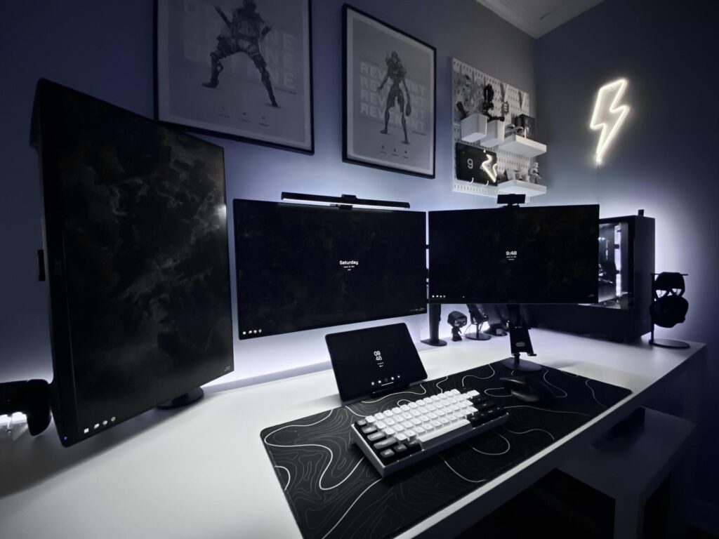 black and white, triple monitor setup