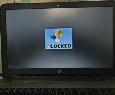Scammers locked elderly fathers pc, anyone know a solution to get back in?